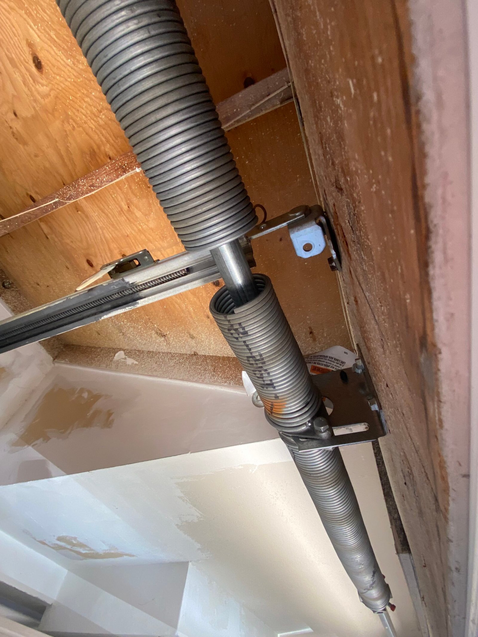 Broken garage door spring repair project in Norwalk CA